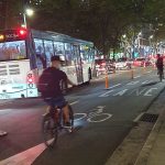 cyclists using a protected bike lane